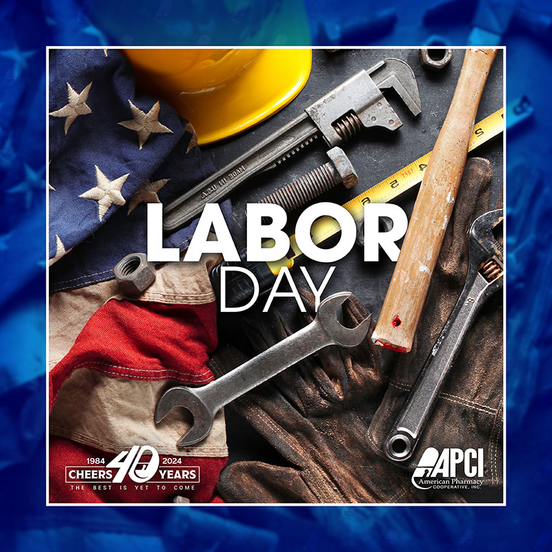 a variety of hand tools with a hard hat, work gloves, and American flag as a background for a Labor Day message with APCI branding