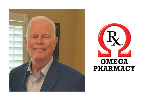 Omega Pharmacy owner Tommy Lindsey with the Omega Pharmacy logo