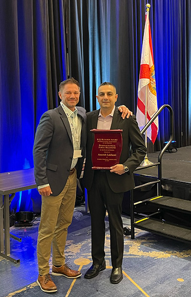 FPA President and APCI member Eric Larson congratulates Aneesh Lakhani, recipient of the 2025 R.Q. Richards Award for Public Relations