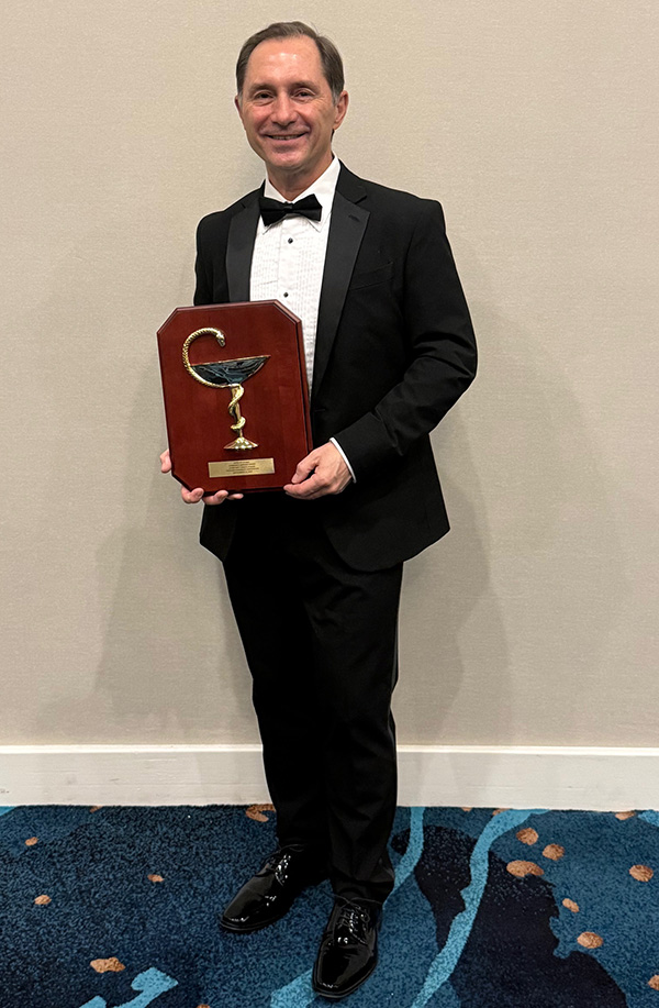 Christian Tadrus with the Bowl of Hygeia award