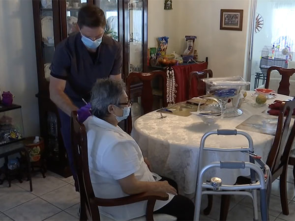 Eric Larson, owner of Prescriptions Unlimited in St. Cloud, Fla. and an APCI Board of Directors member, provides a COVID-19 vaccination to a homebound resident earlier this year.