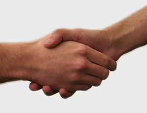 Image of two people shaking hands